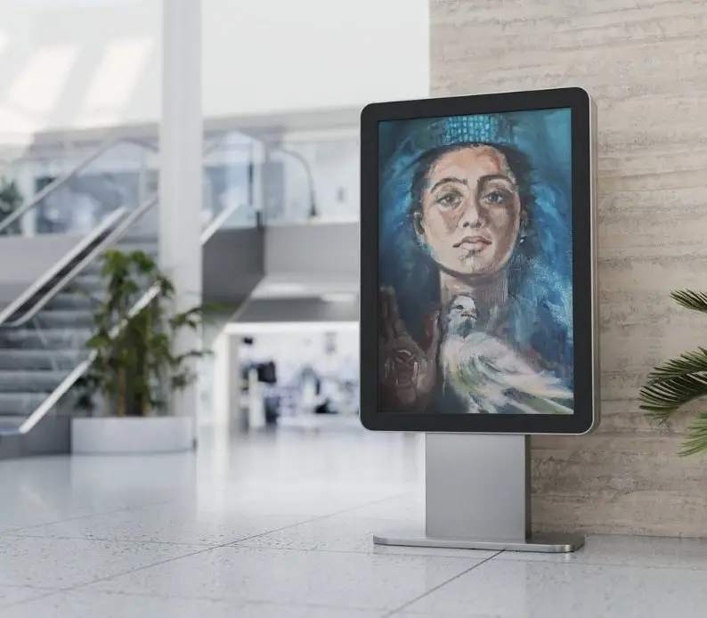 Digital display with artistic portrait in modern interior.