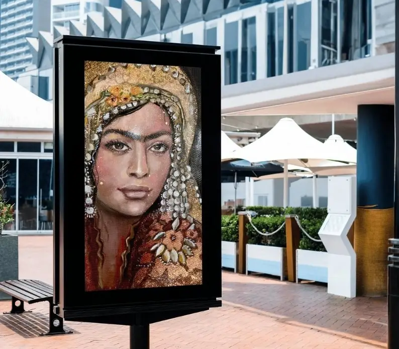 Outdoor portrait art display in urban area.