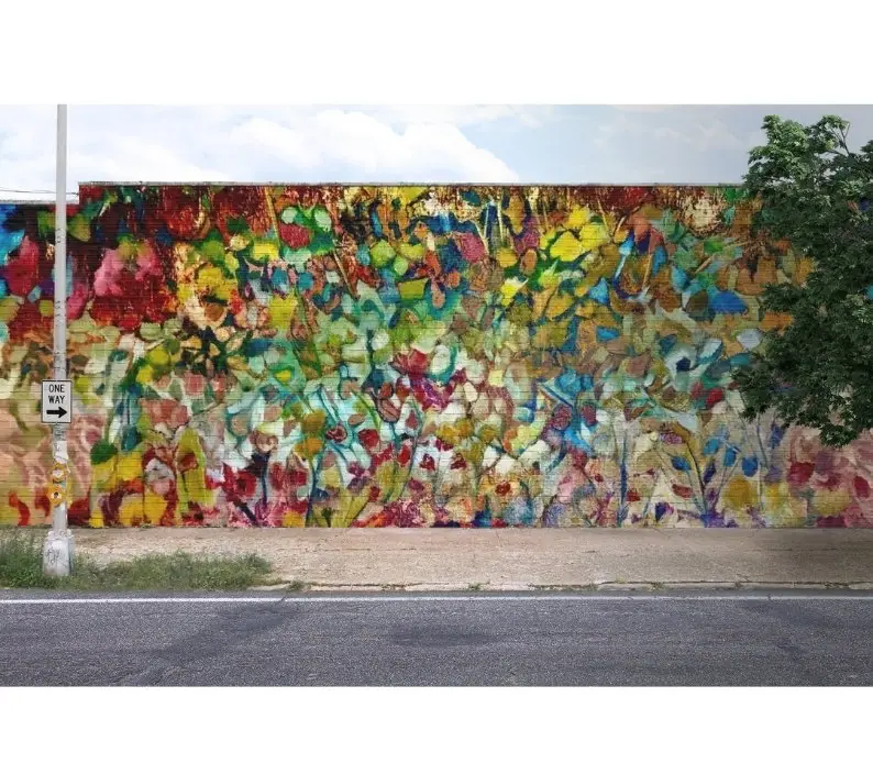 Colorful mural on urban brick wall exterior