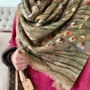 Colorful scarf with floral patterns and designer bag