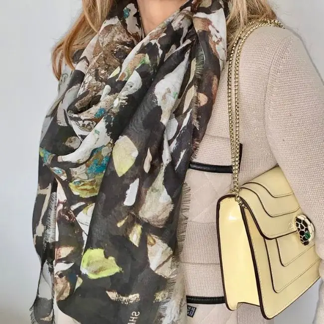 Patterned scarf with beige outfit and yellow bag