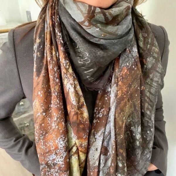 Woman wearing intricate patterned scarf