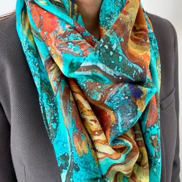 Colorful abstract scarf on gray suit