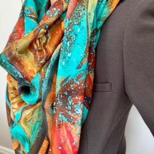 Colorful scarf on gray blazer close-up