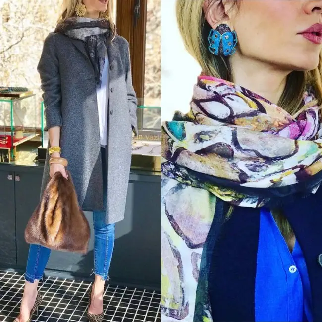 Woman in stylish coat, scarf, and earrings.