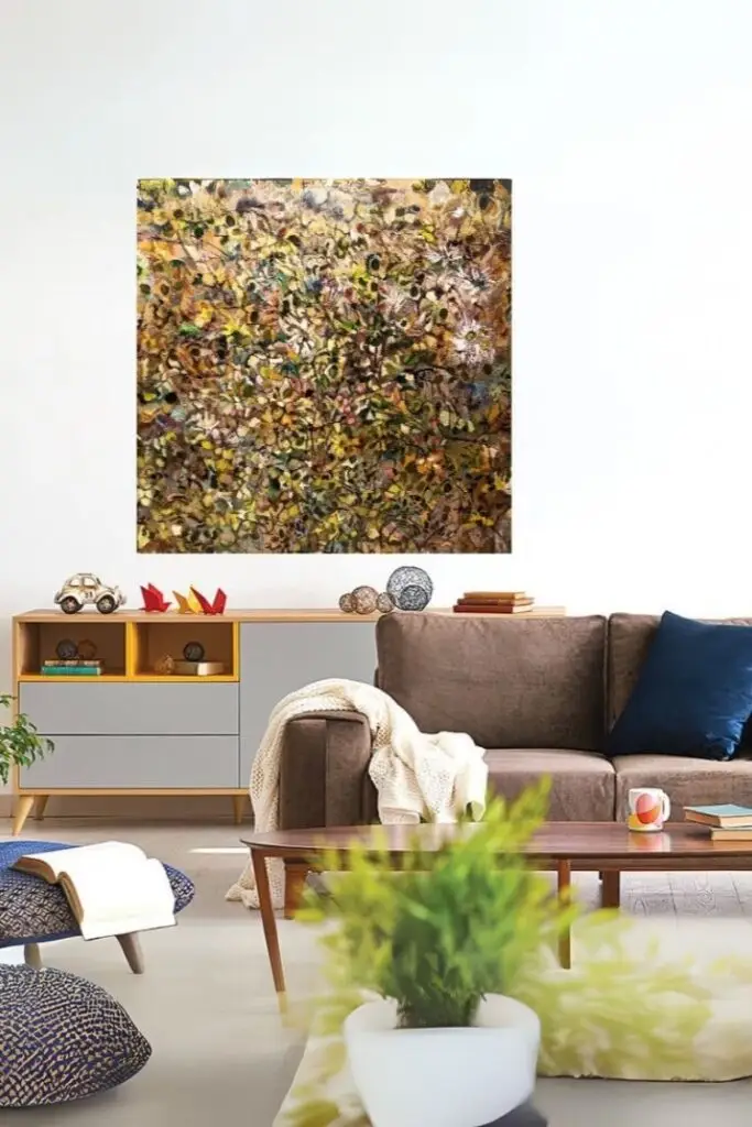 Abstract painting above modern living room sofa