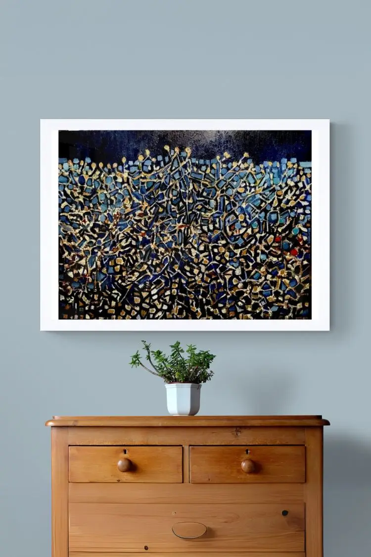 Abstract painting above wooden cabinet with plant