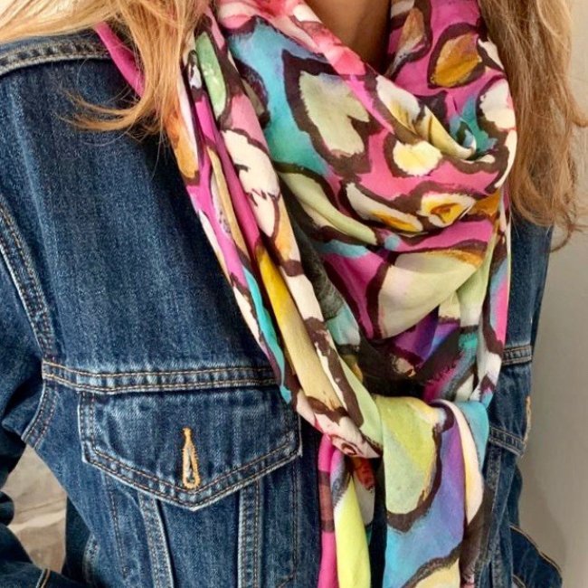 Colorful scarf on denim jacket