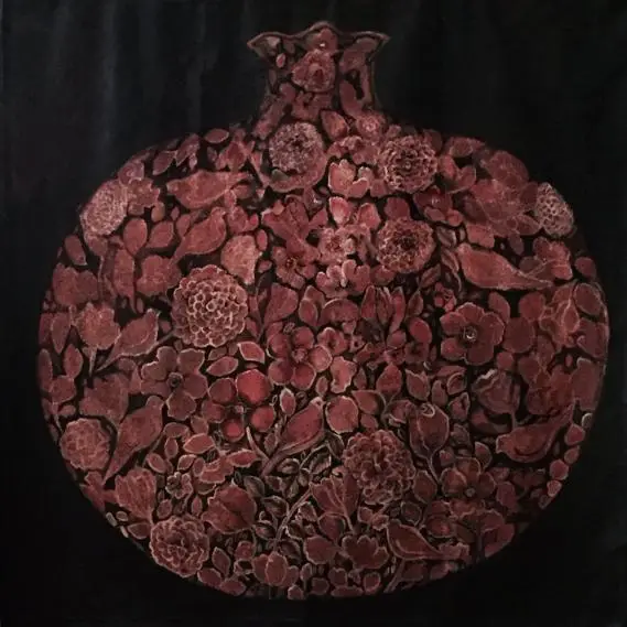 Intricate floral pattern inside pomegranate shape design.