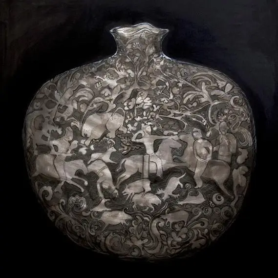 Silver flask with intricate engraved designs and figures.